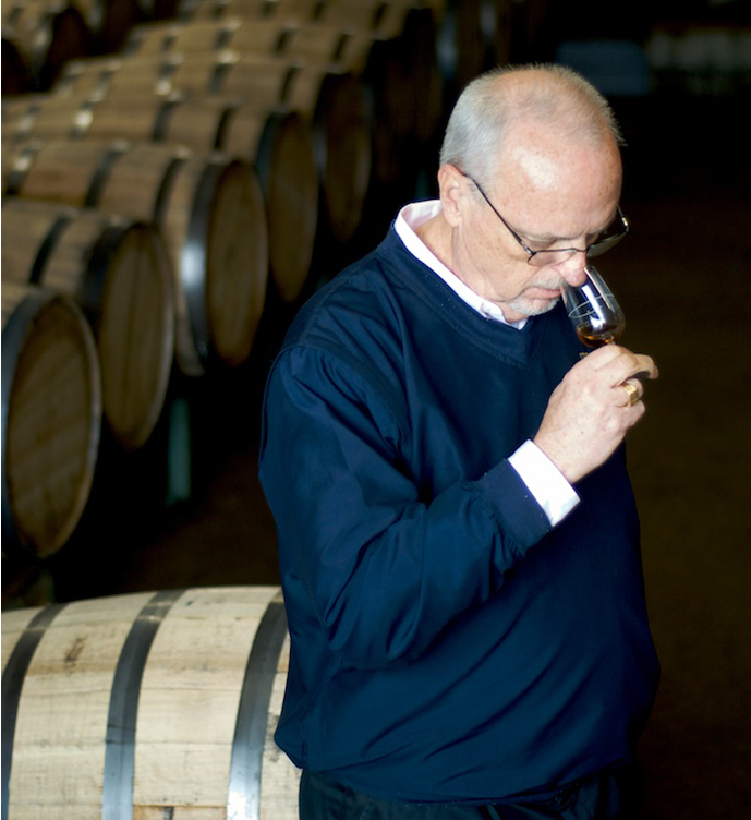Jim Rutledge, the Master Distiller at Four Roses since 1995, takes in the aroma of a single barrel sample of Four Roses.